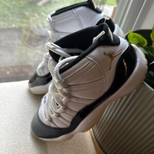 Jordan Kids Black and White Sneakers with Gold Accent